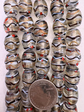 clear dark purple copper white red, dotted swirled line motif, vintage stock glass, 17x13mm barrel, 6" strand, SOLD PER STRAND