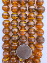 burnt orange copper orange, swirl motif, vintage stock glass, 13x12mm rondelle,  6" strand, SOLD PER STRAND