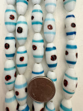 white blue red black, line swirl motif, vintage stock glass, 27x12mm bowed tube, 6" strand, SOLD PER STRAND