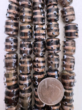 brown purple black white copper, eye swirl motif, vintage stock glass, 15x13mm raised dots barrel, 6" strand, SOLD PER STRAND