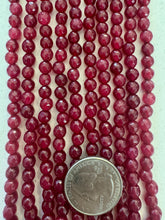 color enhanced quartz: ruby red, 6mm faceted round, 15" strand,  SOLD PER STRAND
