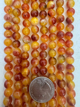 color enhanced quartz: orange red, 8mm round, 15" strand,   SOLD PER STRAND