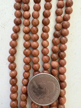 goldstone, 6mm round, 15" strand,  15" strand, SOLD PER STRAND