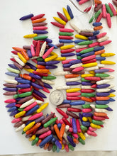 color enhanced magnesite: multi color, 25x6x6mm point pendants, 15" strand, SOLD PER STRAND