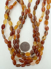 carnelian, 12x9x5mm oval, 15" strand, sold per strand