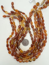 carnelian, 12x9x5mm oval, 15" strand, sold per strand