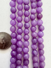 color enhanced quartz: dark pale red purple, 8mm faceted round, 15" strand, SOLD PER STRAND