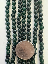 color enhanced quartz: dark emerald green, 6mm faceted round, 15" strand,  SOLD PER STRAND