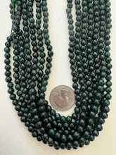 color enhanced quartz: dark emerald green, 6mm faceted round, 15" strand,  SOLD PER STRAND