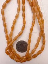 red aventurine, 18x5mm bowed tube, 15" strand, sold per strand