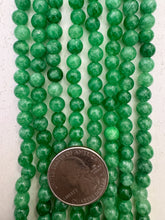 color enhanced quartz: emerald green, 6mm round, 15" strand,  SOLD PER STRAND
