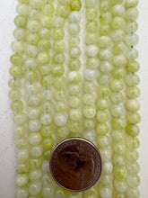 color enhanced quartz: bright pale lime green, 6mm round, 15" strand, SOLD PER STRAND