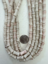 color enhanced quartz: off white very pale pink, 16x8mm dent tube, 15" strand,  SOLD PER STRAND