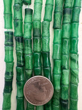 color enhanced quartz: light and dark emerald green, 26x7mm carved tube, 15" strand,  SOLD PER STRAND