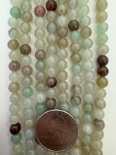 color enhanced quartz: dark pale mint green brown, 6mm round, 15" strand,  SOLD PER STRAND