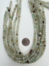 color enhanced quartz: dark pale mint green brown, 6mm round, 15" strand,  SOLD PER STRAND
