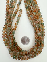 color enhanced quartz dark orange green off white, 8mm round,  15" strand,    SOLD PER STRAND