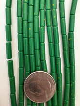 color enhanced magnesite: pale dark blue green yellow spots, 14x4mm tube, 15" strand,  SOLD PER STRAND