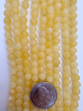 yellow calcite, 6mm round, 15" strand,  SOLD PER STRAND