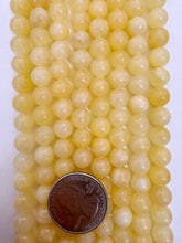 yellow orange calcite, 8mm round, 15" strand,   SOLD PER STRAND