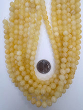 yellow orange calcite, 8mm round, 15" strand,   SOLD PER STRAND