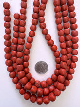 color enhanced magnesite: dark pale red, 11mm rounded cube, 15" strand, SOLD PER STRAND