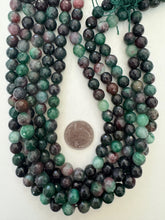 color enhanced quartz: dark blue green maroon, 10mm faceted round, 15" strand, SOLD PER STRAND