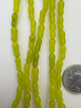 color enhanced quartz: lime green, 12x5mm dog bone tube, 15" strand,  SOLD PER STRAND
