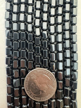 hematite, 7x5mm faceted barrel, 15" strand,  SOLD PER STRAND
