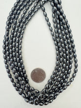 hematite, 8x5mm bowed tube, 15" strand,  SOLD PER STRAND