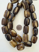 dark chocolate brown yellowed off white, faux bone, vintage look resin, 29x23mm barrel, 15" strand, SOLD PER STRAND