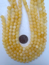 yellow orange calcite, 8mm round, 15" strand, sold per strand (darker batch)