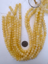 yellow orange calcite, 8mm round, 15" strand, sold per strand (darker batch)
