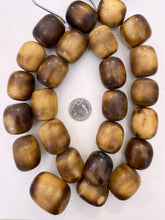brown pale peach off white, faux bone, vintage look resin, 29x26mm barrel, 15" strand,  SOLD PER STRAND