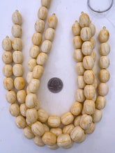 faux bone look, dark lines motif, vintage resin beads, 20x15mm barrel, 15" strand,   SOLD PER STRAND
