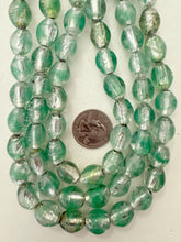 clear sea foam green metallic silver inside lined, vintage stock glass, 16x13mm barrel, 15" strand, sold per strand