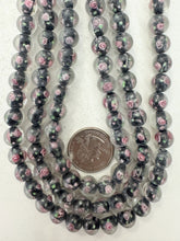 pink rose motif black inside lined, dull finish, vintage stock glass, 10mm round, 12" strand, sold per strand