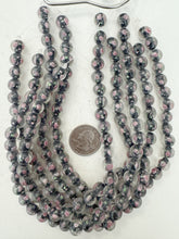 pink rose motif black inside lined, dull finish, vintage stock glass, 10mm round, 12" strand, sold per strand