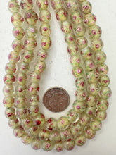 pink rose motif pale yellow inside lined, dull finish, vintage stock glass, 10mm round, 14" strand, sold per strand
