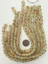 pink rose motif pale yellow inside lined, dull finish, vintage stock glass, 10mm round, 14" strand, sold per strand