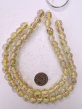 pink rose motif pale yellow inside lined, dull finish, vintage stock glass, 13mm round, 13" strand, sold per strand