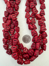 color enhanced magnesite: dark red, 16x16x8mm buddha skull head, 15" strand,  SOLD PER STRAND
