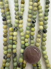 yellow turquoise, 6mm round, 15" strand,  SOLD PER STRAND