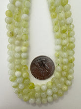 color enhanced quartz: pale lime green, 6mm round, 15" strand, sold per strand