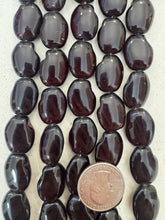 color enhanced quartz: very dark red, 21x16x7mm oval nugget, 15" strand,   SOLD PER STRAND