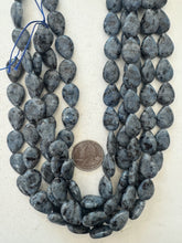 color enhanced black labradorite: pale blueberry blue, semi dull finish, 17x13x6mm teardrop, 15" strand,   SOLD PER STRAND