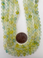 color enhanced quartz: dark yellow blue, 6mm round, 15" strand, sold per strand