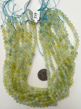 color enhanced quartz: dark yellow blue, 6mm round, 15" strand, sold per strand