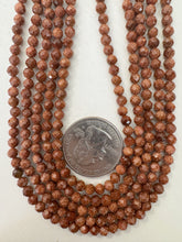 goldstone (glass), 4mm faceted round, 15" strand, sold per strand