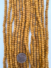 amber enhanced raw wood,  6x5mm rondelle, 15" strand, sold per strand